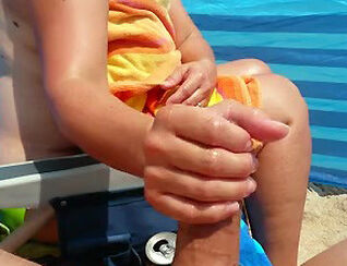 Mature wifey gives flawless hand job on the beach and makes
